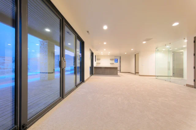 Basement family room and wet bar alternate angle in Deer Mountain custom home, Park City