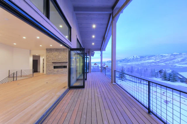 Covered deck from outside with valley views in Deer Mountain custom home, Park City