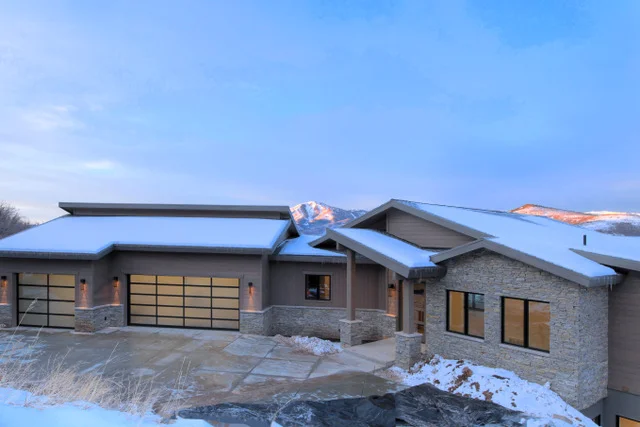Front entry close-up showing stone and siding detail in Deer Mountain custom home, Park City