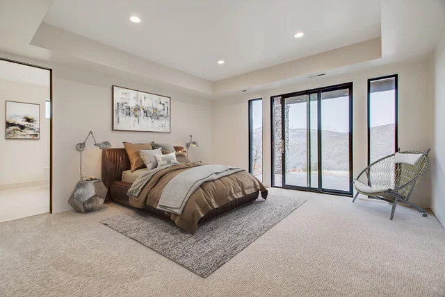Master suite with king bed and tray ceiling in Deer Mountain custom home, Park City