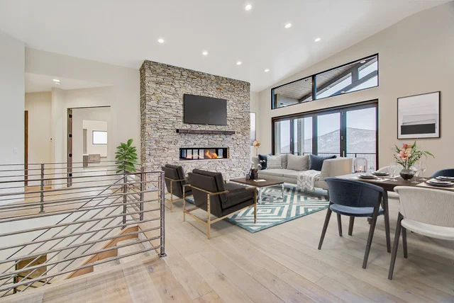 Staged great room with stone fireplace