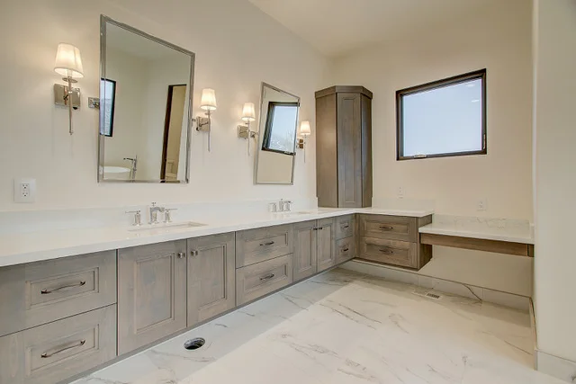 Master bath dual vanity with corner cabinet and makeup area in Slalom Run custom home