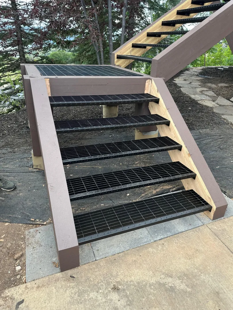 Deck stairs with metal grate
