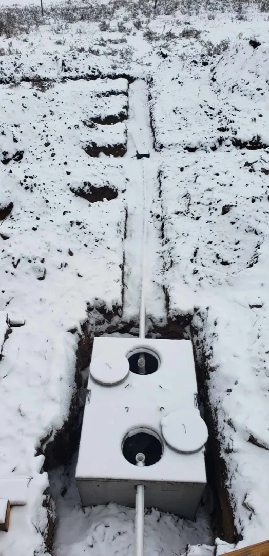 Septic system tank installed in excavated ground