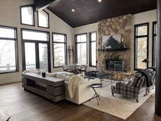 Floor-to-ceiling stone fireplace feature